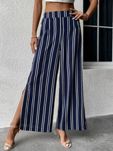 Women's striped commuter style slit high waist wide leg pants