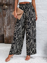 Women's elegant geometric print loose trousers