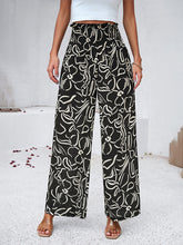 Women's elegant geometric print loose trousers